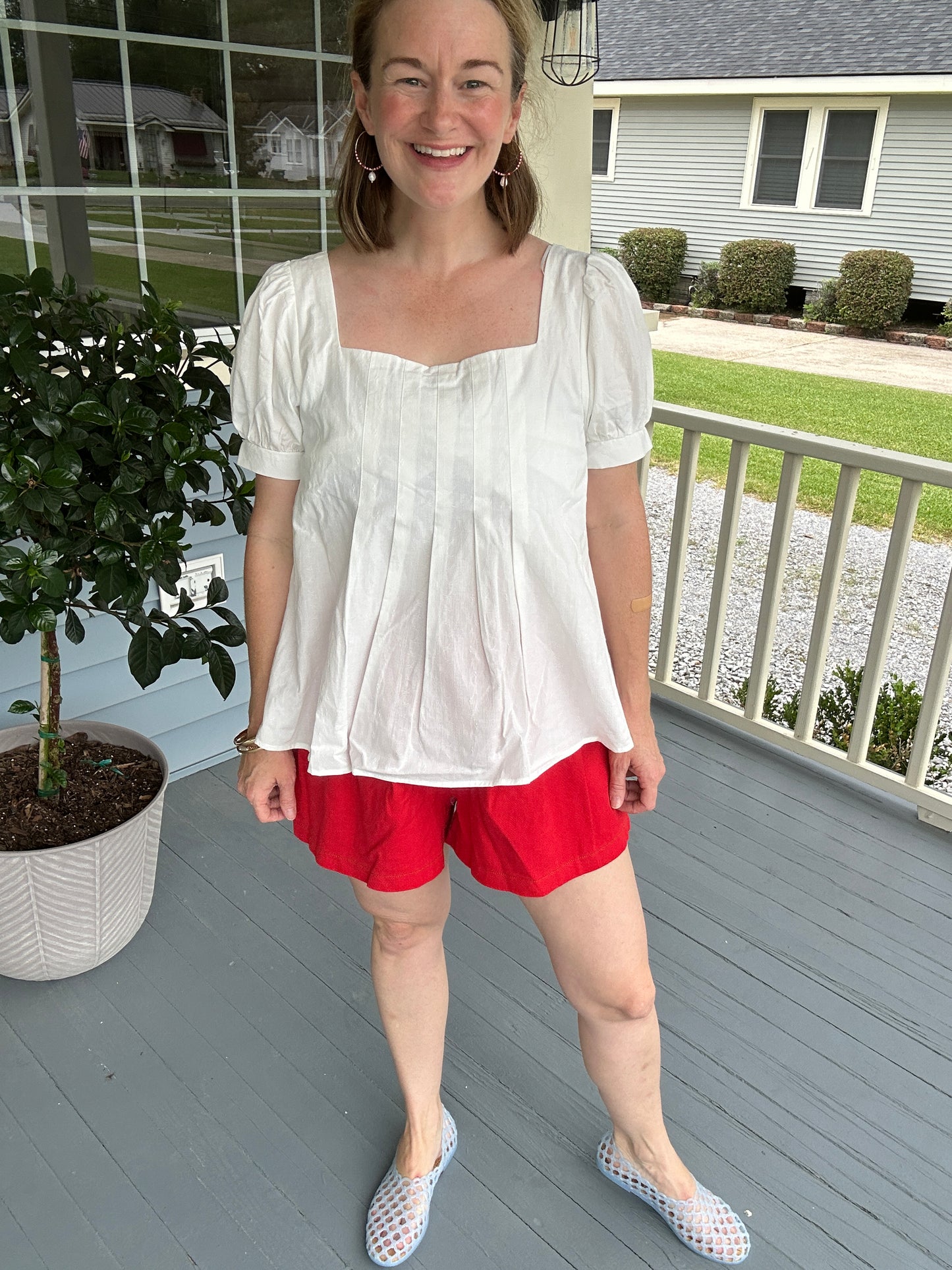 White peplum pleated top