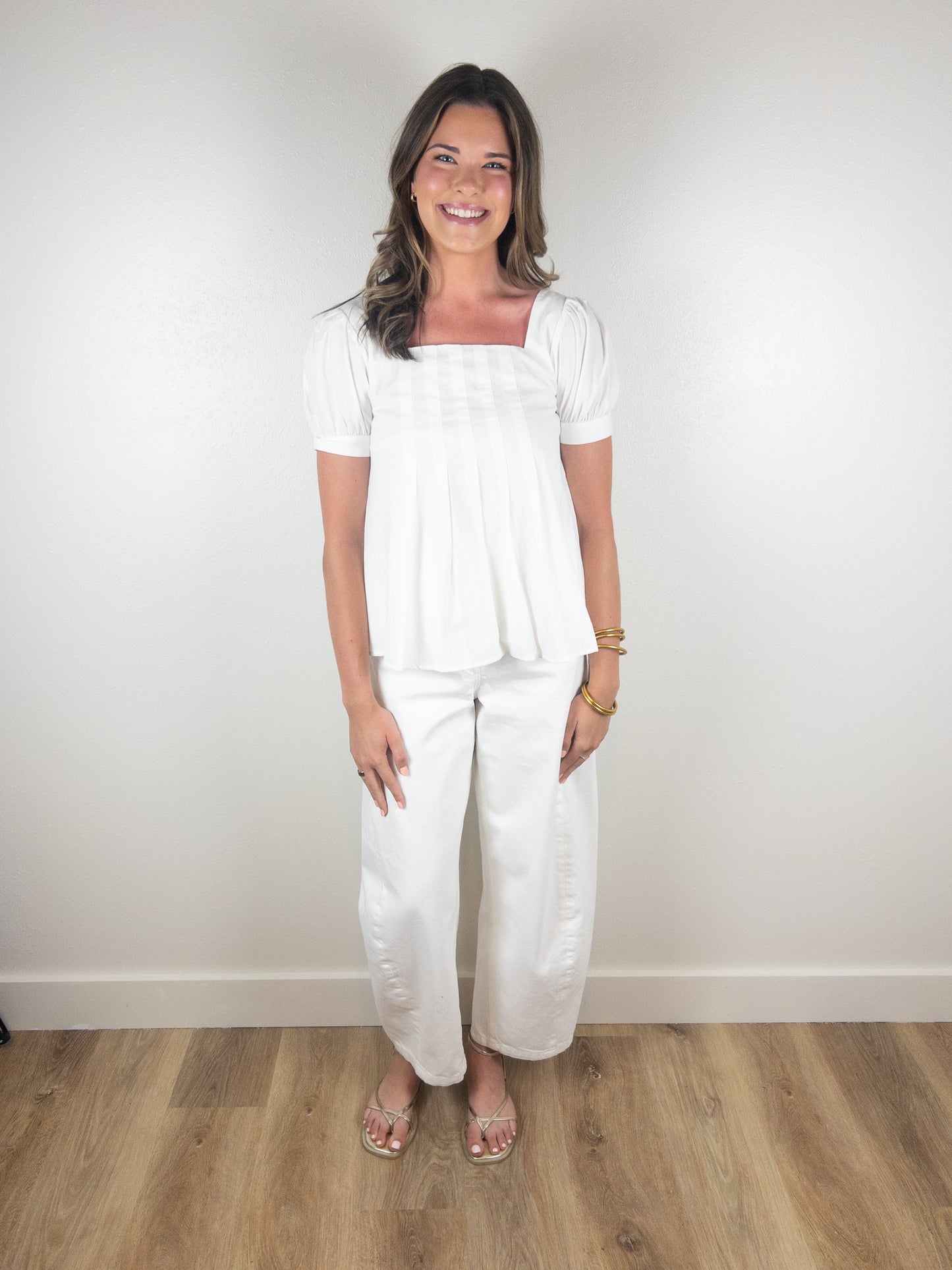 White peplum pleated top