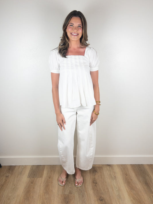 White peplum pleated top