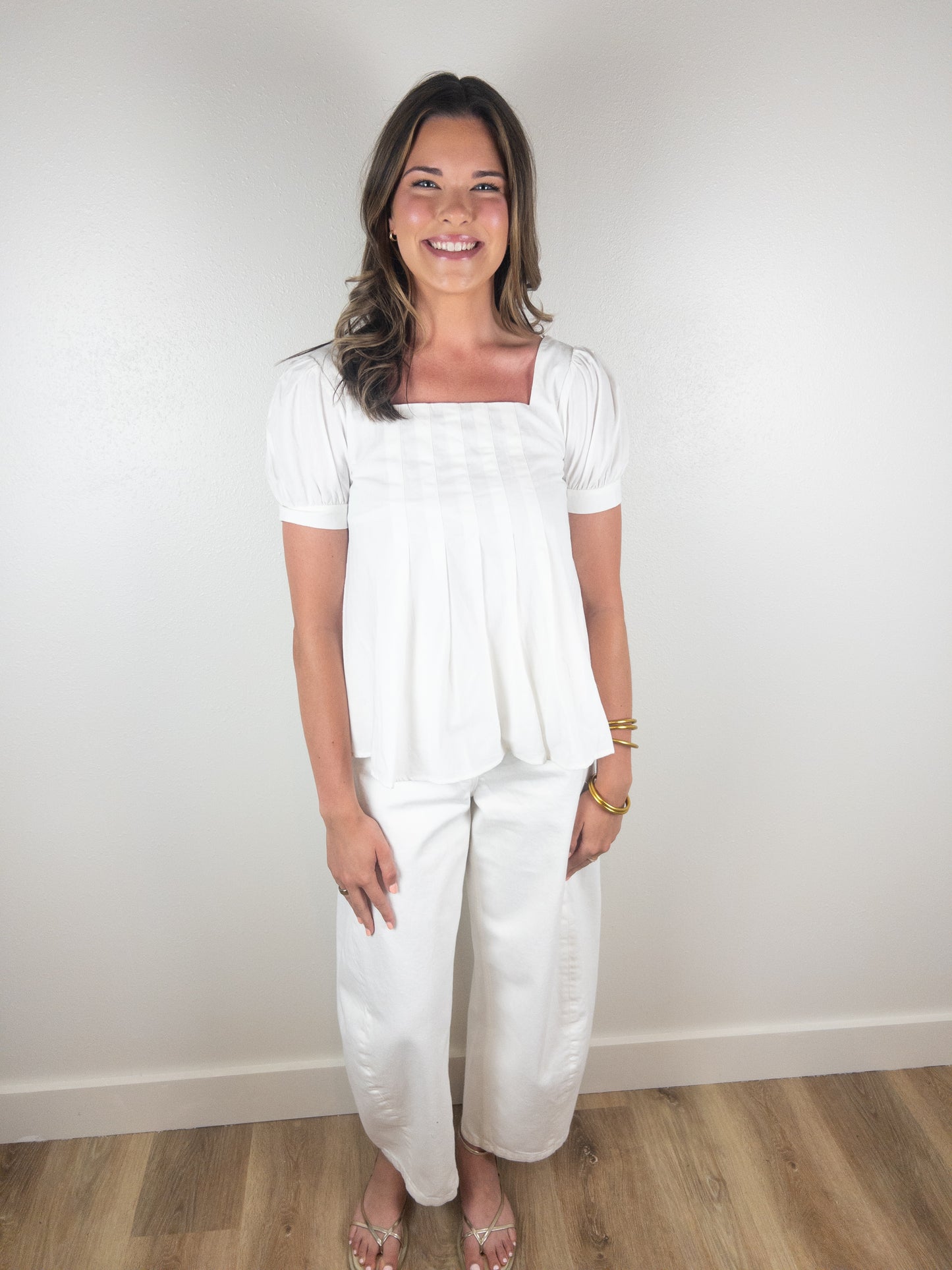 White peplum pleated top