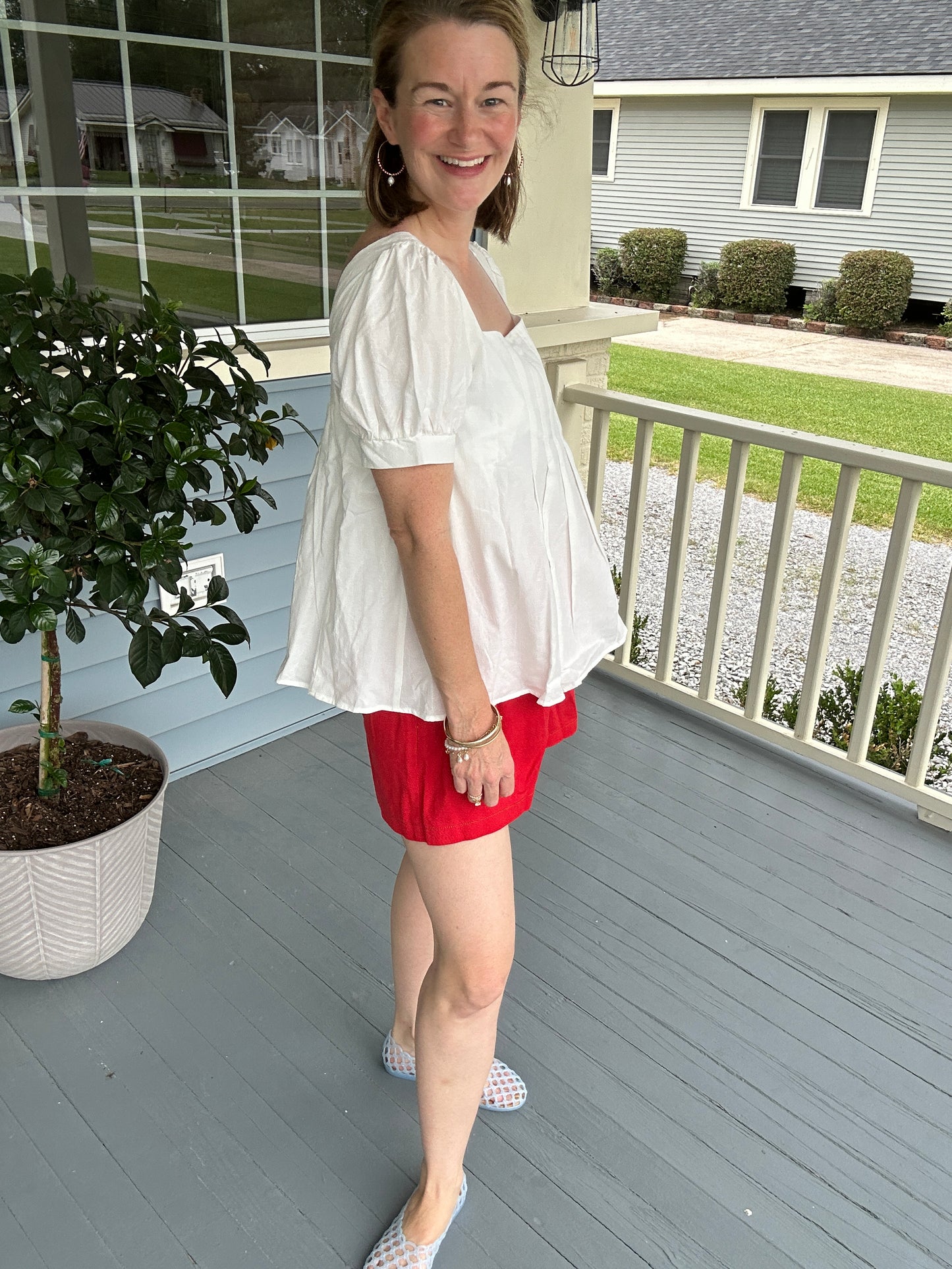 White peplum pleated top